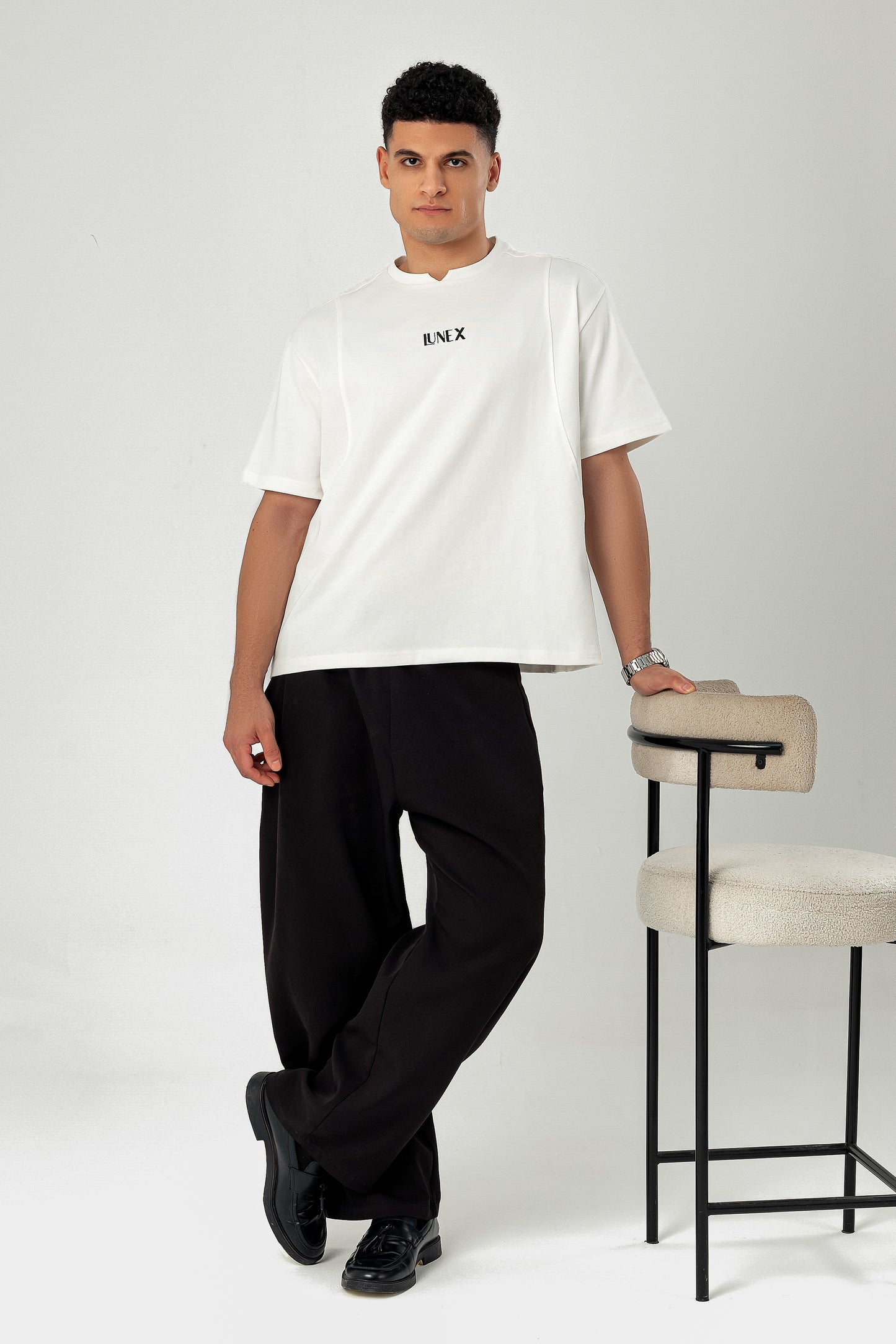 Model in LUNEX off-white heavyweight tee — editorial lifestyle