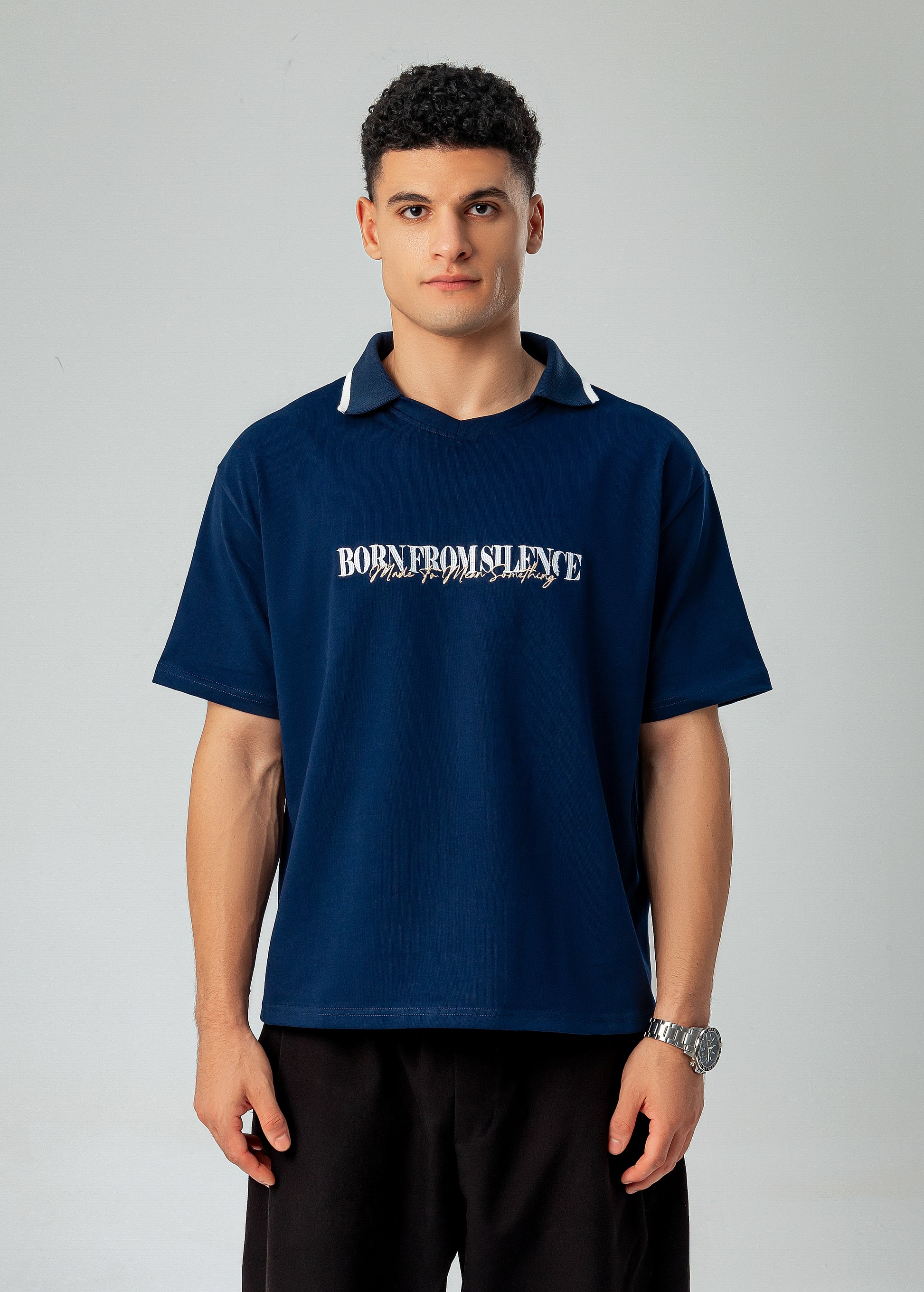 LUNEX navy polo tee — "Born from silence" chest print, open collar