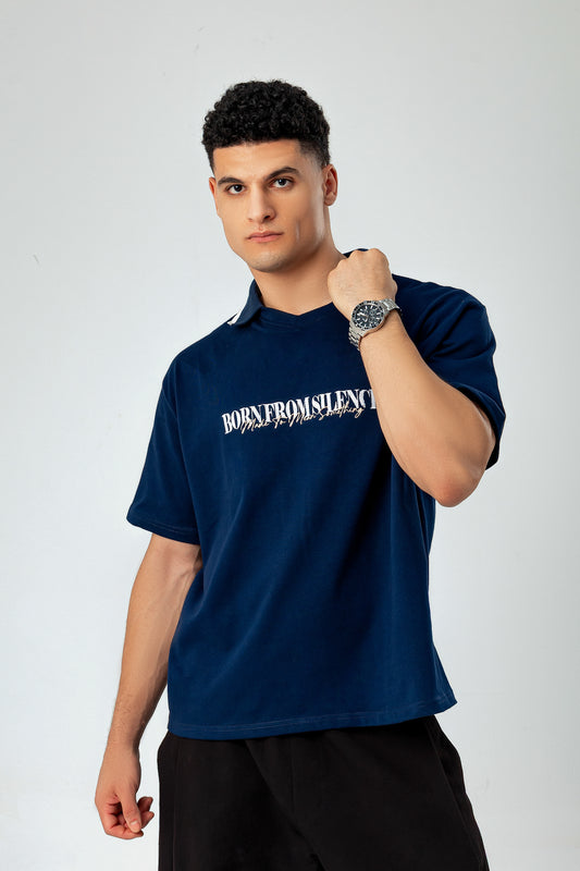 Model in LUNEX navy boxy polo tee — oversized drop-shoulder fit
