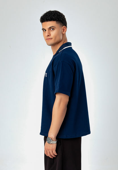 Side view of LUNEX navy boxy polo tee with contrast-tipped collar
