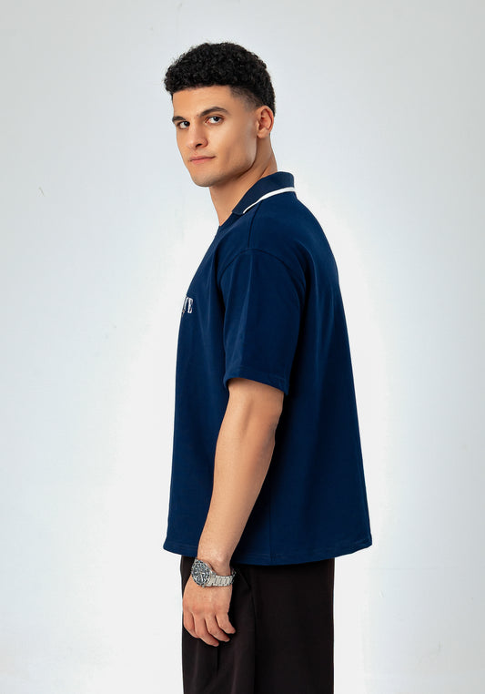 Side view of LUNEX navy boxy polo tee with contrast-tipped collar