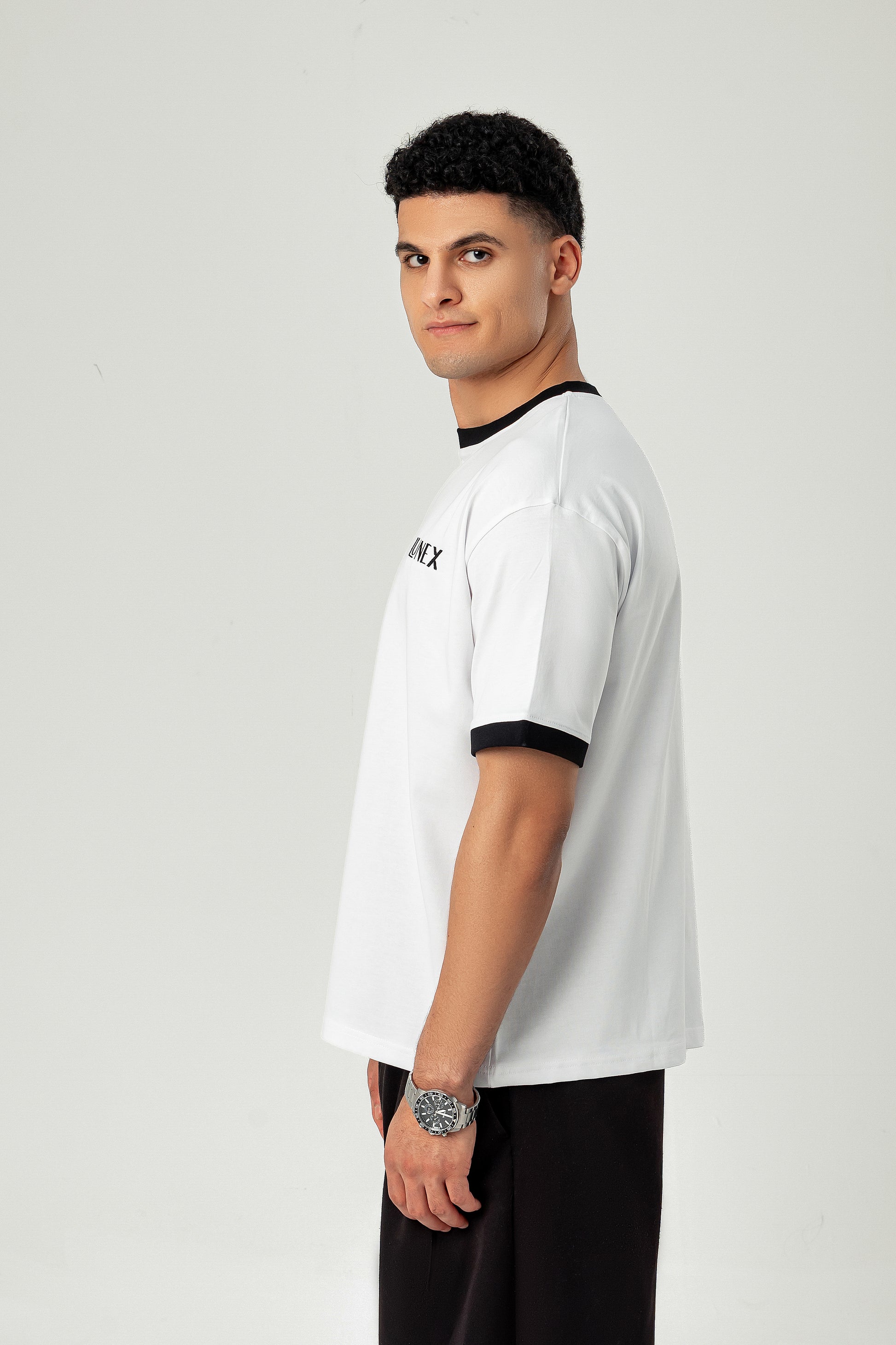 Side view of LUNEX white ringer tee with black trim